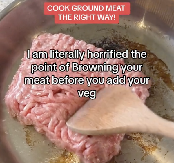 raw minced meat in a frying pan with writing over it